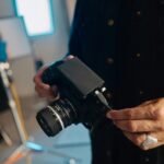 A man holding a camera in his hands